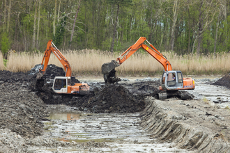 Excavators restoring peat bog after peat extraction at Westhay Moor nature reserve in Somerset. Picture: Guy Edwardes/2020Vision