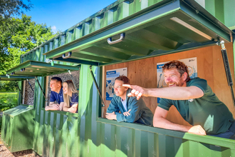 Staff from BBOWT and Grundon in the new lakeside bird hide at the Nature Discovery Centre