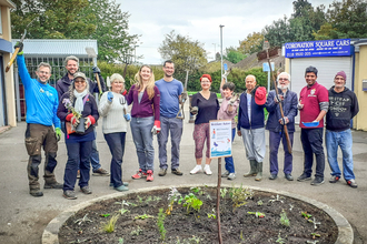 BBOWT Community Wildlife Officer Ed Munday (left) with residents of Southcote, Reading, planting herbs and flowers at Coronation Square as part of the Trust's Nextdoor Nature project. Picture: Kate Titford