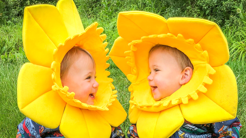 Two children dressed up as daffodils 