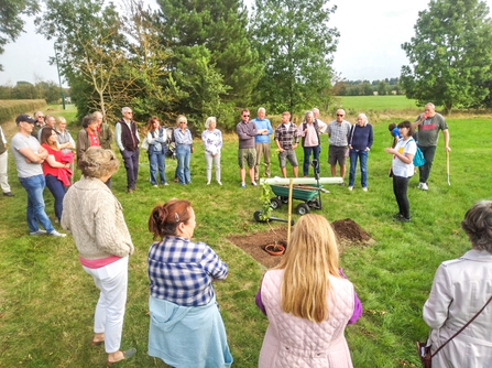 Villagers in Quainton planting the first apple tree in their community orchard at the conclusion of BBOWT's Hedgerow Havens project. Picture: Marcus Militello