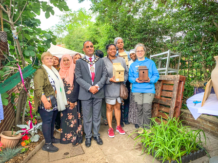 Mayor of Slough Amjad Abbasi with Barbara Polonara from BBOWT (in blue) at the opening of the Ujala Foundation community garden