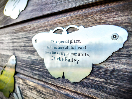 BBOWT Chief Executive Estelle Bailey's Your Wild Memories butterfly plaque at the Nature Discovery Centre