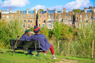 Friends sitting on a bench in a suburban park. Picture: Wei Huang
