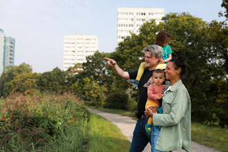 A family (parents with children) look for wildlife in a park for 30 Days Wild. Picture: Eleanor Church