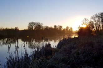 Sunrise at Cholsey Marsh by Charlotte Day - winner of the landscape category at the BBOWT Photography Competition 2022.