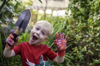 Children going wild: a young boy does a spot of gardening as part of 30 Days Wild