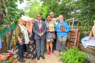 Mayor of Slough Amjad Abbasi with Barbara Polonara from BBOWT (in blue) at the opening of the Ujala Foundation community garden