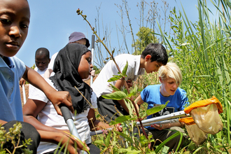 Children pond dipping at Woolley Firs Environmental Education Centre, Berkshire