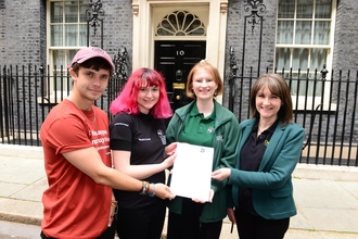 Representatives of the Wildlife Trusts delivering a High Speed Two (HS2) petition to Number Ten Downing Street, London