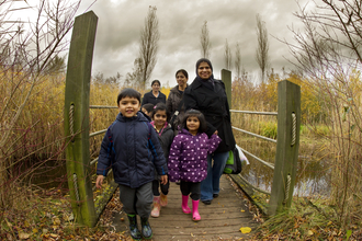 Family on a bridge at College Lake