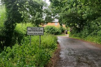 Road sign on a grassy verge saying Welcome to Nethercote