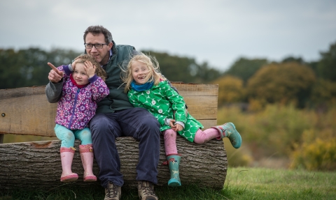 Man and children on winter walk