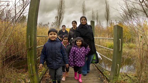 Family on a bridge at College Lake