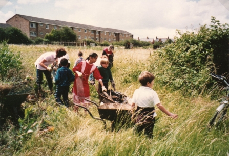 Local children clearing land in summer, 1991