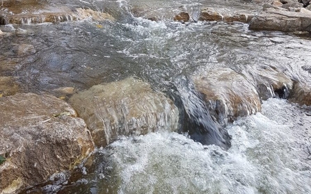 Example of water flowing over a stone step