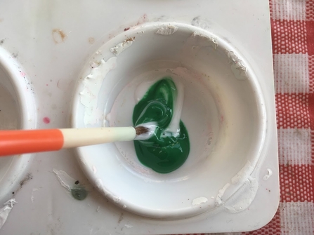 Mixing paint in pot
