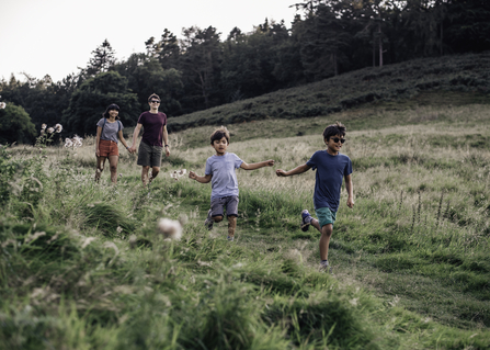 Family walk outdoors - Credit Evie and Tom Photography.