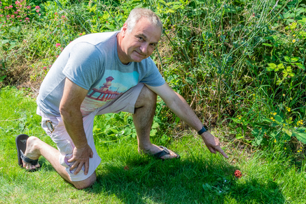 Caversham resident Terry Driscoll points to one of the stinkhorn fungi that sprouted in his garden in July 2021. Picture: Tony Hayward