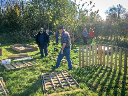 Volunteers from Bicester Green help build BBOWT's Engaging with Nature community garden at the Nature Discovery Centre. Picture: Lis Speight