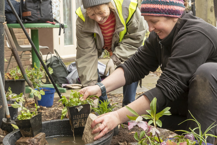 Residents make a wildlife pond as part of a Wildlife Trusts community project. Picture: Penny Dixie