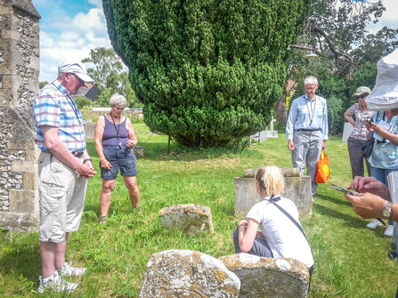 Learning to survey the churchyard at Sydenham Church, part of the Rough Around the Edges project. Photo by Katie Horgan