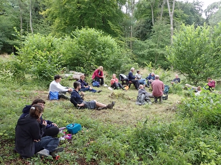 Volunteers sitting down and taking a break