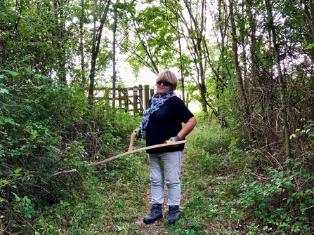 Volunteer scything at Finemere Wood