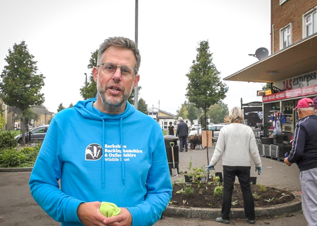 BBOWT Community Wildlife Officer Ed Munday helping plant flowers in Coronation Square in Southcote, Reading, as part of the Trust's Nextdoor Nature project. Picture: Kate Titford