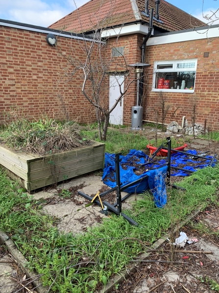 The space behind the Slough Ujala community centre in January 2023 before BBOWT started leading work to create a garden