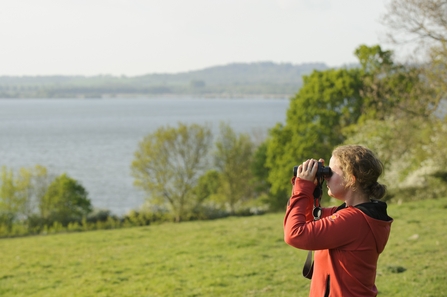 Young woman birdwatching
