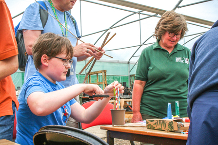 Matthew Webb makes a bee hotel as part of BBOWT's Engaging with Nature project with The Autism Group in Maidenhead