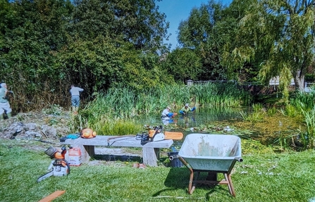 Volunteers clearing a pond