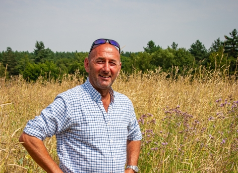 Jordans farm partnership farmer Guy in field