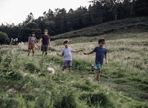 Family walk outdoors - Credit Evie and Tom Photography.