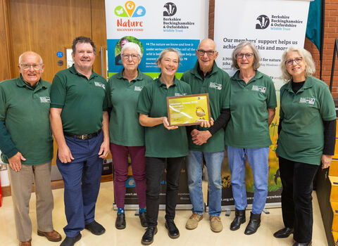 Members of Wild Banbury proudly holding their framed Volunteer Award certificate
