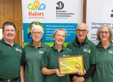 Members of Wild Banbury proudly holding their framed Volunteer Award certificate